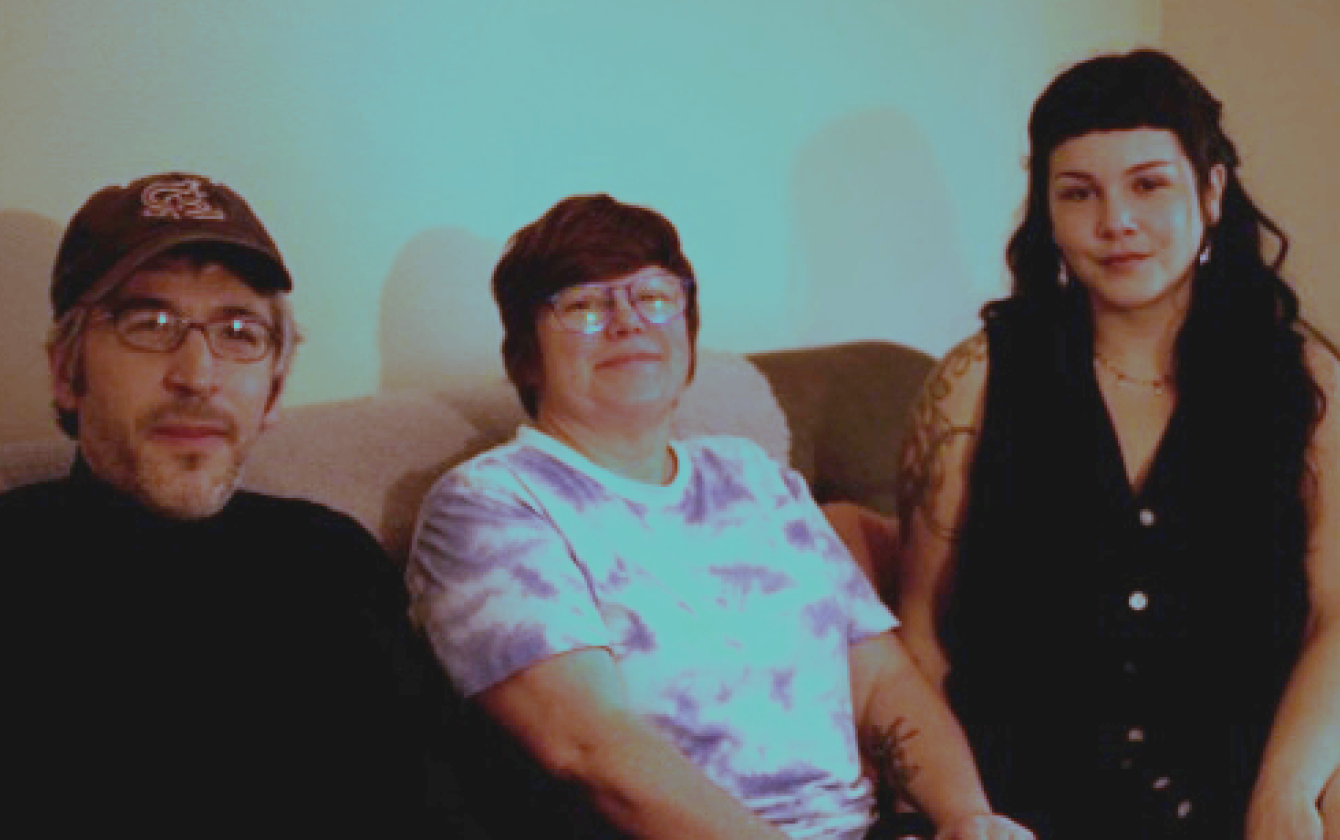 a photo of the band Common Birds - a three human band sitting on a couch