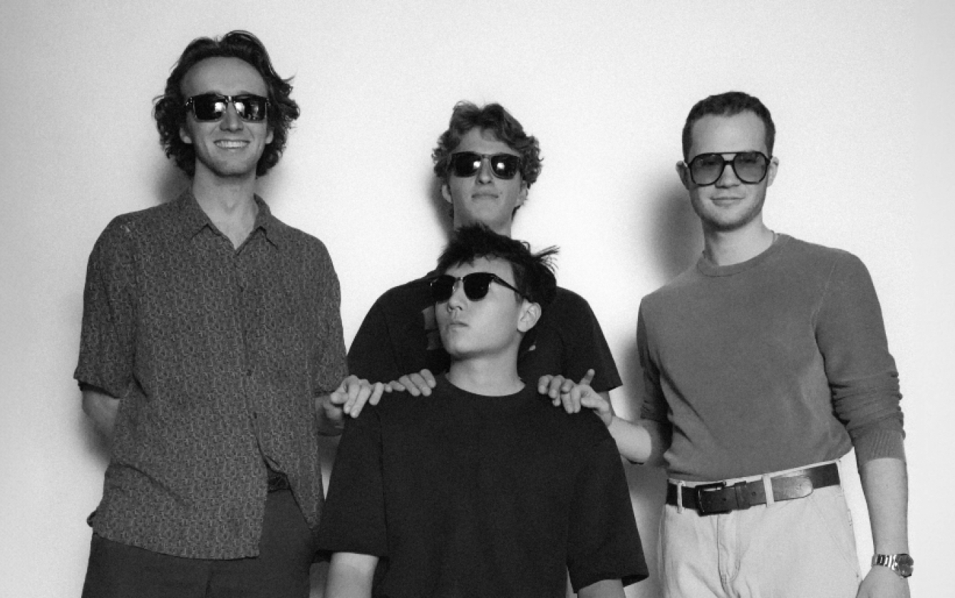 A photo of the four person band Abunto - they're all wearing sunglasses