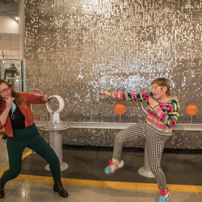 in front of sparkle wall musicians perform