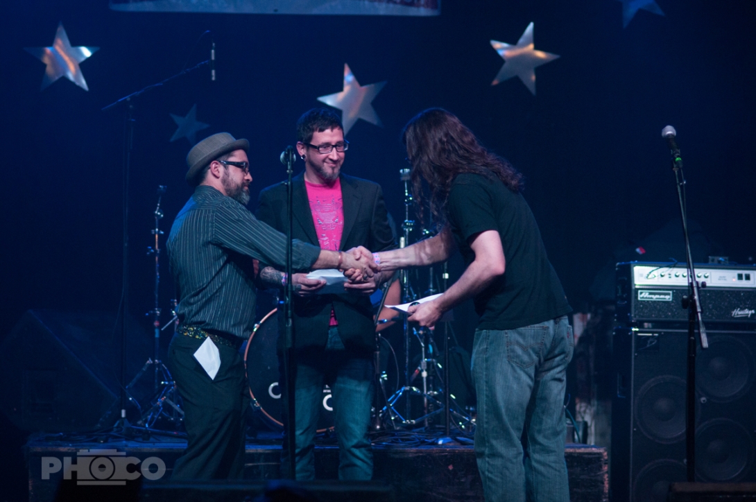 Artists shake hands at the Peer Awards