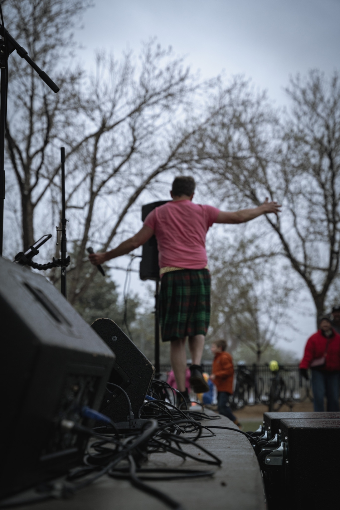 Walking along the front of the stage Swash Docs singer balances precaiously