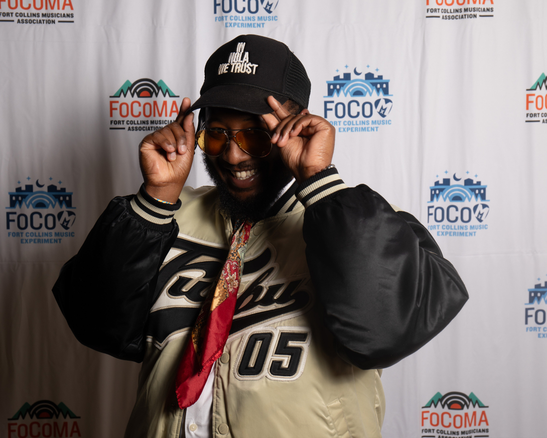 Guests at Peer Awards Photo by Marc Leverette standing in front of FoCoMA step-and-repeat 