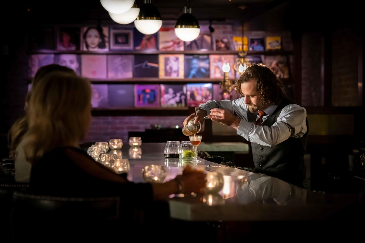 Ace Gillet's bartender pours a drink Photo provided by Ace Gillet's 